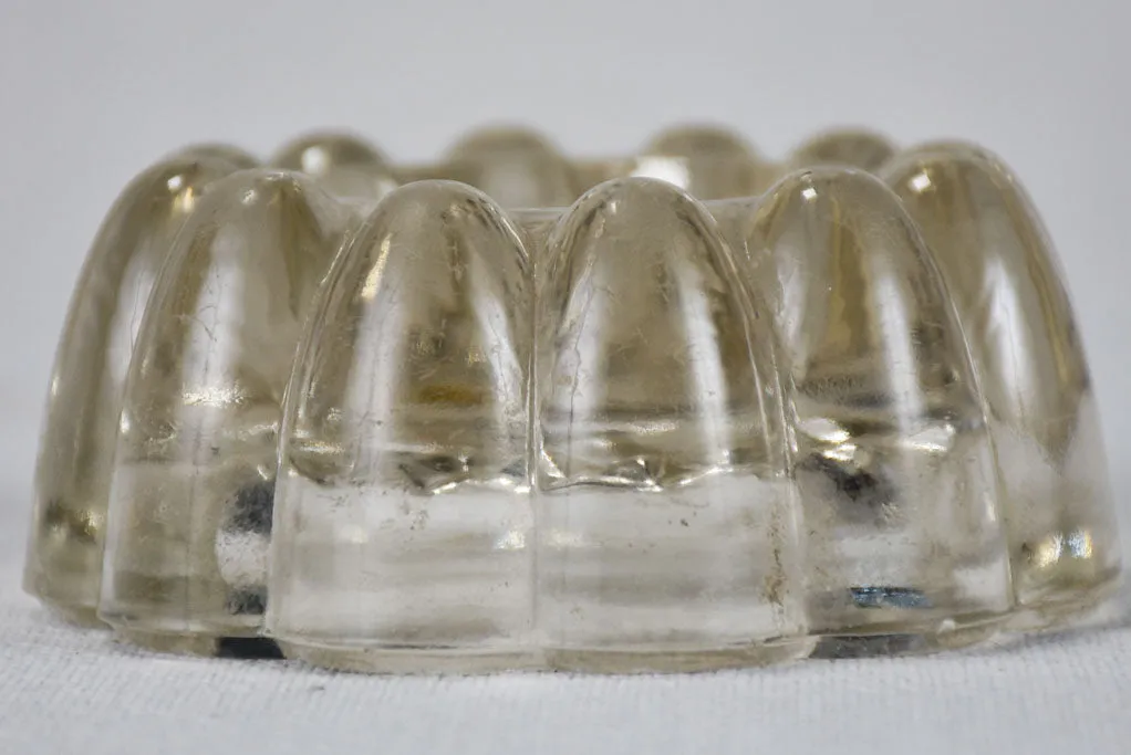 Set of four vintage French glass table risers