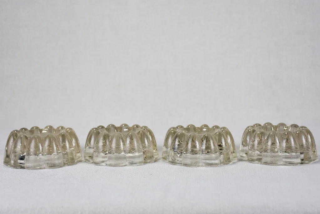 Set of four vintage French glass table risers
